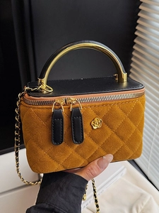 Yellow suede box bag with quilted stitching and contrast black leather flap with gold handle