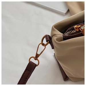 Nylon crossbody bag detail showcasing durable hardware, stitching, and waterproof fabric.