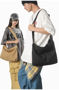 Detailed comparison of large canvas crossbody bags in black and khaki shown on models