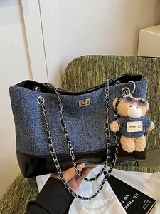 Contrast stitching denim and leather tote bag with chain strap and teddy bear charm