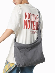 Large dark grey canvas crossbody bag with adjustable strap and front pocket