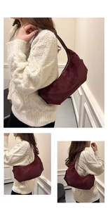 Detailed views of burgundy suede crescent underarm bag showing texture and styling