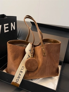 Vintage brown suede tote bag with diamond quilting and wide logo canvas strap