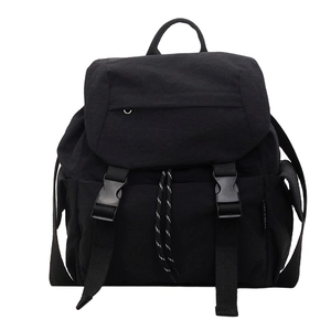 Minimalist black nylon sports backpack with flap buckle closure and side pockets for travel