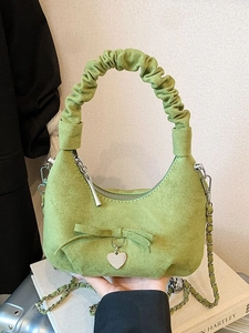 Minimalist grass green suede crescent bag with cloud handle and heart charm pendant