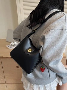 Classic black PU leather bucket bag with gold metal lock and cute strawberry charm