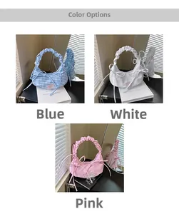 Detail of checkered and solid shoulder bags with pleated handles and bow accents