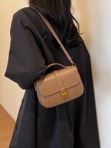 Chic brown textured leather handbag with gold buckle and adjustable strap for women