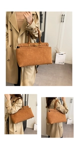 Detail view of large brown suede tote bag with metal buckle and shoulder strap options