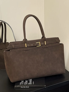 Large brown suede tote bag with decorative gold buckle belt and dual handles