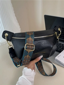 Retro black leather crossbody dumpling bag with colorful ethnic jacquard strap and gold hardware