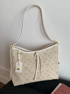 Borsa tote beige chiaro con stampe di cani cartoni e manici in pelle bianca