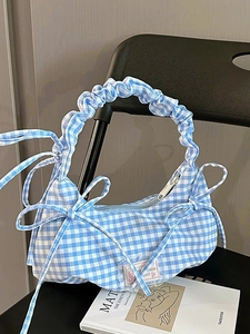 Blue and white gingham shoulder bag with scrunched handle and decorative side bows