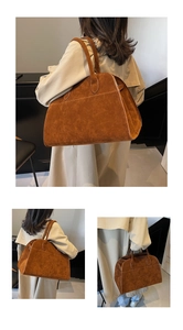 Detalle del bolso tote de ante marrón mate mostrando las costuras finas y gran capacidad