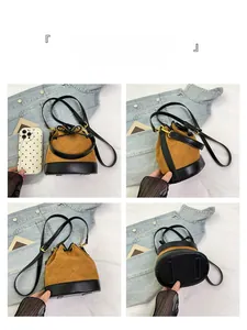 Vue détaillée du sac seau vintage avec daim marron et surpiqûres matelassées chic