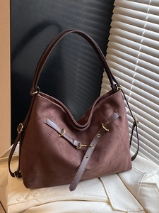 Deep brown matte tote bag with retro buckles and large capacity displayed on white fabric