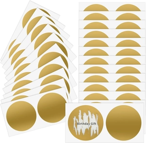 Close-up of round gold scratch-off stickers showing Birthday Gift text reveal