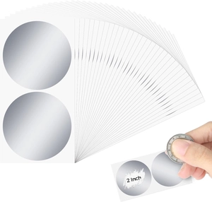 Macro view of 2-inch silver round scratch-off stickers for lottery games and rewards