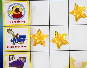 Holographic star reward stickers on a task chart for children behavior tracking