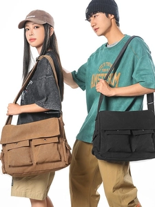 Große Unisex-Messenger-Taschen aus Segeltuch in Schwarz und Braun mit vielen Taschen