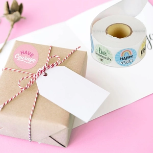 Colorful motivational reward stickers roll with phrases for gift sealing and office decor