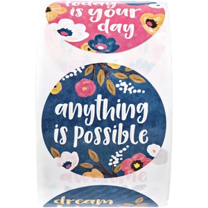 Close-up of floral gift stickers roll with inspirational quotes for gift packaging