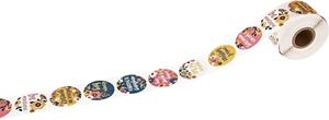 Macro view of floral thank you stickers with motivational text on a 500 label roll