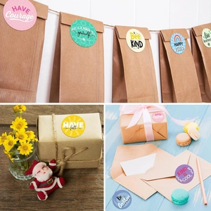 Detail showing colorful motivational stickers used for sealing paper bags and gift boxes