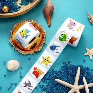 Cartoon ocean animal sticker roll with various marine life patterns on blue sea background