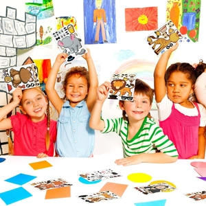 Children creating DIY cartoon animal stickers with colorful elephant and lion designs