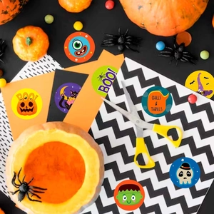 Detailed view of Halloween stickers featuring pumpkins and monsters on colorful cardstock