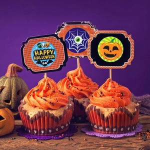Halloween cupcake toppers set with pumpkin and Happy Halloween text on orange frosting