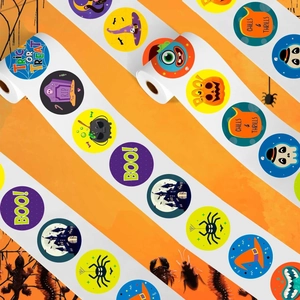 Roll of Halloween stickers featuring pumpkins and ghosts on an orange themed background