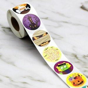 Macro shot of Halloween trick or treat roll stickers with assorted cartoon festive patterns