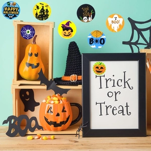 Macro detail of various Halloween stickers on items with pumpkins and bats patterns