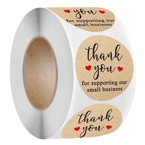 Roll of round kraft paper thank you stickers with olive branch and red heart design