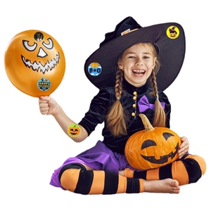 Roll of Halloween stickers featuring pumpkins and witches for festive kids party decor