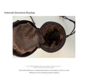 Detail view of round coconut fiber mini bag showing brown fabric lining and secure zipper