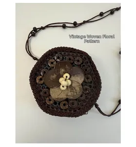 Close-up of retro braided flower pattern with wooden beads on a mini woven bag