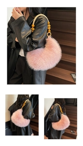 Detail of pink faux fur moon bag with yellow wooden bead and woven handle accents