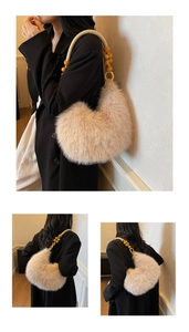 Close-up of crescent plush shoulder bag featuring woven rope strap and wooden beads
