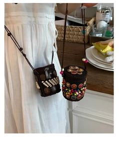 Detail of bohemian handmade coconut shell mini crossbody bag with ethnic beadwork design