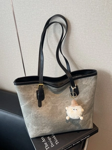 Grey marble texture tote bag with gold hardware and plush charm for office use