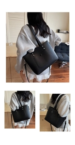 Detail der schwarzen Tote-Bag aus genarbtem Leder mit silbernen Nieten und Tasche