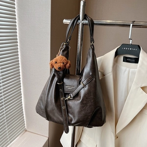 Deep brown oversized retro shoulder bag with smooth PU leather texture and plush dog charm