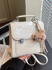 Chic cream mini backpack with butterfly texture and plush bear charm for women