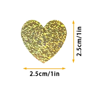 Detail showing a 1-inch heart-shaped sticker with golden holographic glitter texture