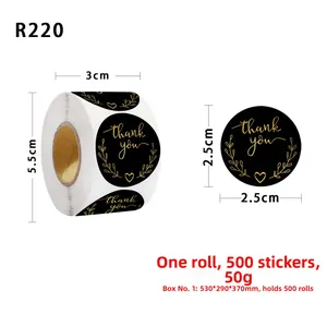 Macro detail of 2.5cm black and gold Thank You stickers on a roll for business decor