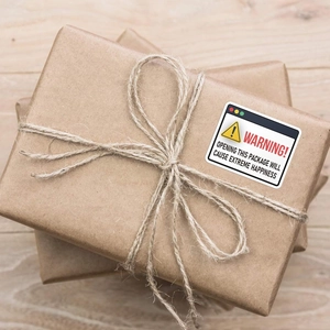 Creative computer popup warning sticker on kraft paper parcel with rustic twine
