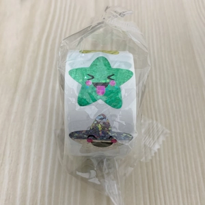 Macro detail of self-adhesive star reward stickers with cute faces and glitter finish